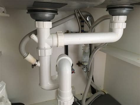 2 drain pipes under kitchen sink